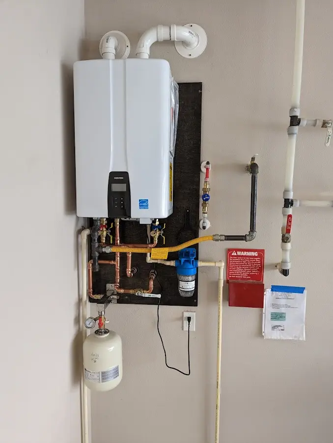 Professional plumber installing copper piping in a Otsego Lake home